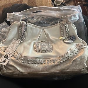 Kathy van zeeland purse, brand new never used barley even touched.